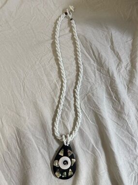 White Beaded Necklace with Black Teardrop Shell Pendant